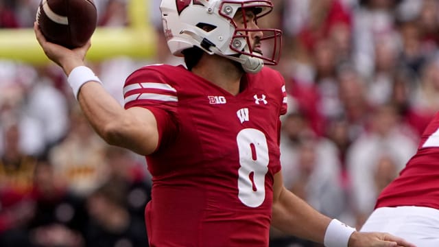 Wisconsin quarterback Tanner Mordecai (8) looks for an open receiver during the second quarter of their game against Iowa Saturday, October 14, 2023 at Camp Randall Stadium in Madison, Wisconsin.